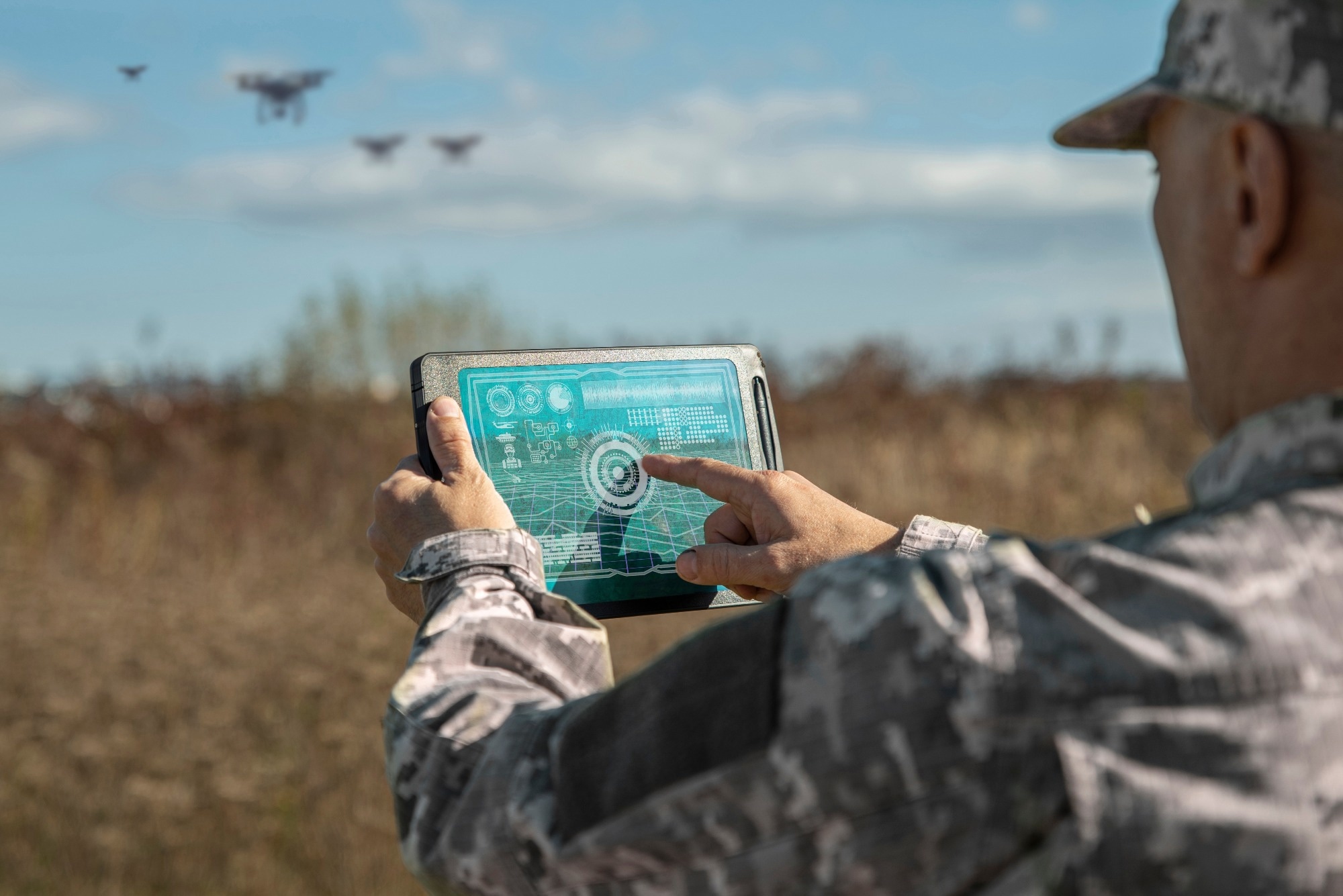 Operator reviewing drone mission data on a tablet